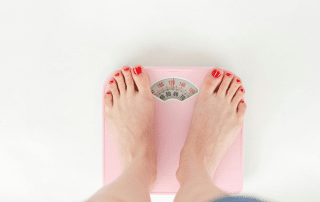 Patient with PCOS learning about Semaglutide and Tirzepatide at Columbine Aesthetics — call 720-504-4407 to explore weight loss options for PCOS-related weight gain.
