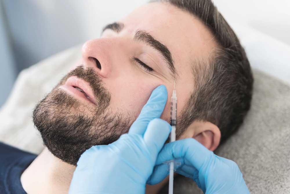 Patient receiving Botox treatments in Colorado at Columbine Aesthetics to smooth forehead lines for a natural, youthful look.